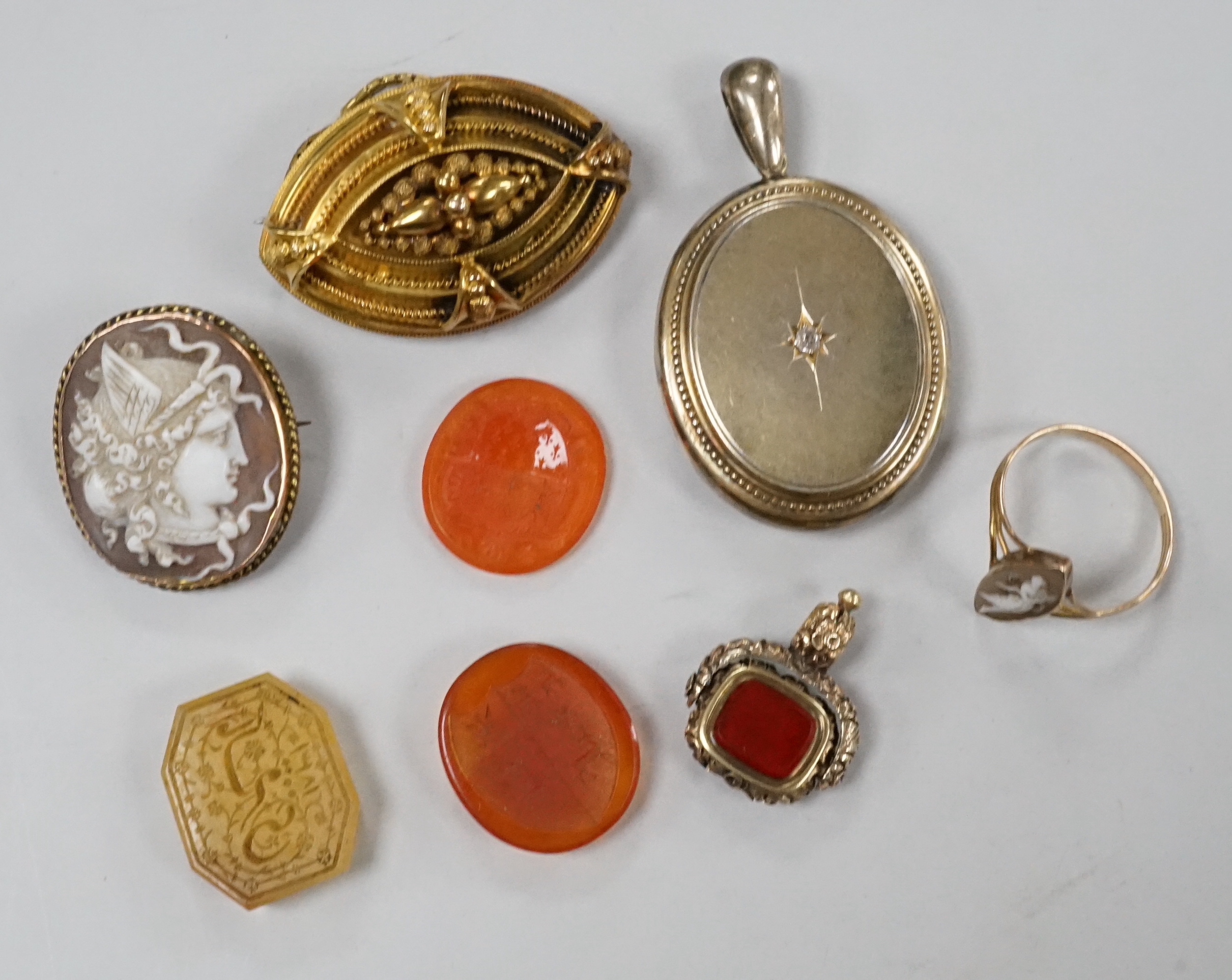 Assorted Victorian jewellery including cameo shell brooch and ring, diamond set locket, brooch, spinning fob seal and three unmounted carnelian intaglios.